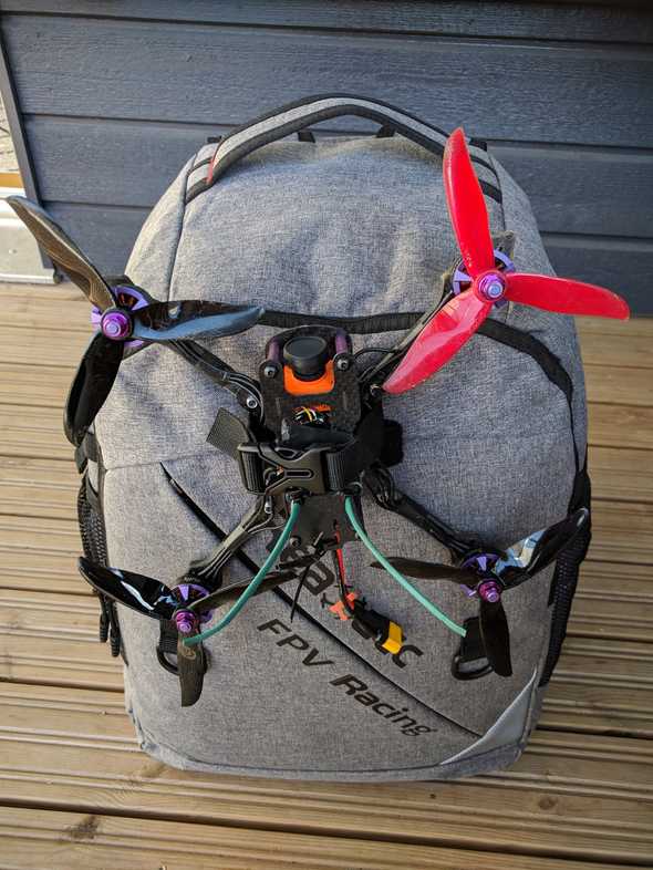 Realacc backpack with a drone attached to it