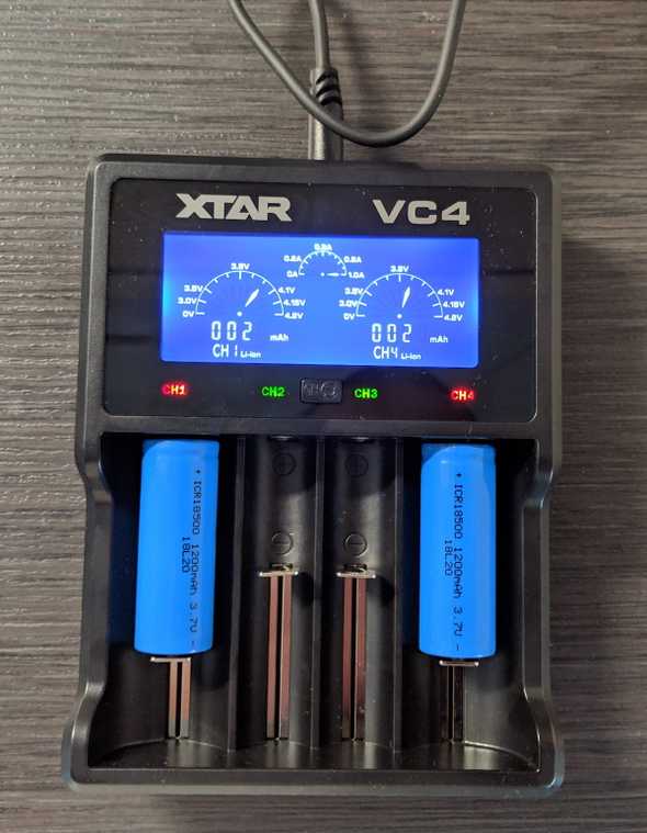 Xtar battery charger charging a pair of 18500 batteries